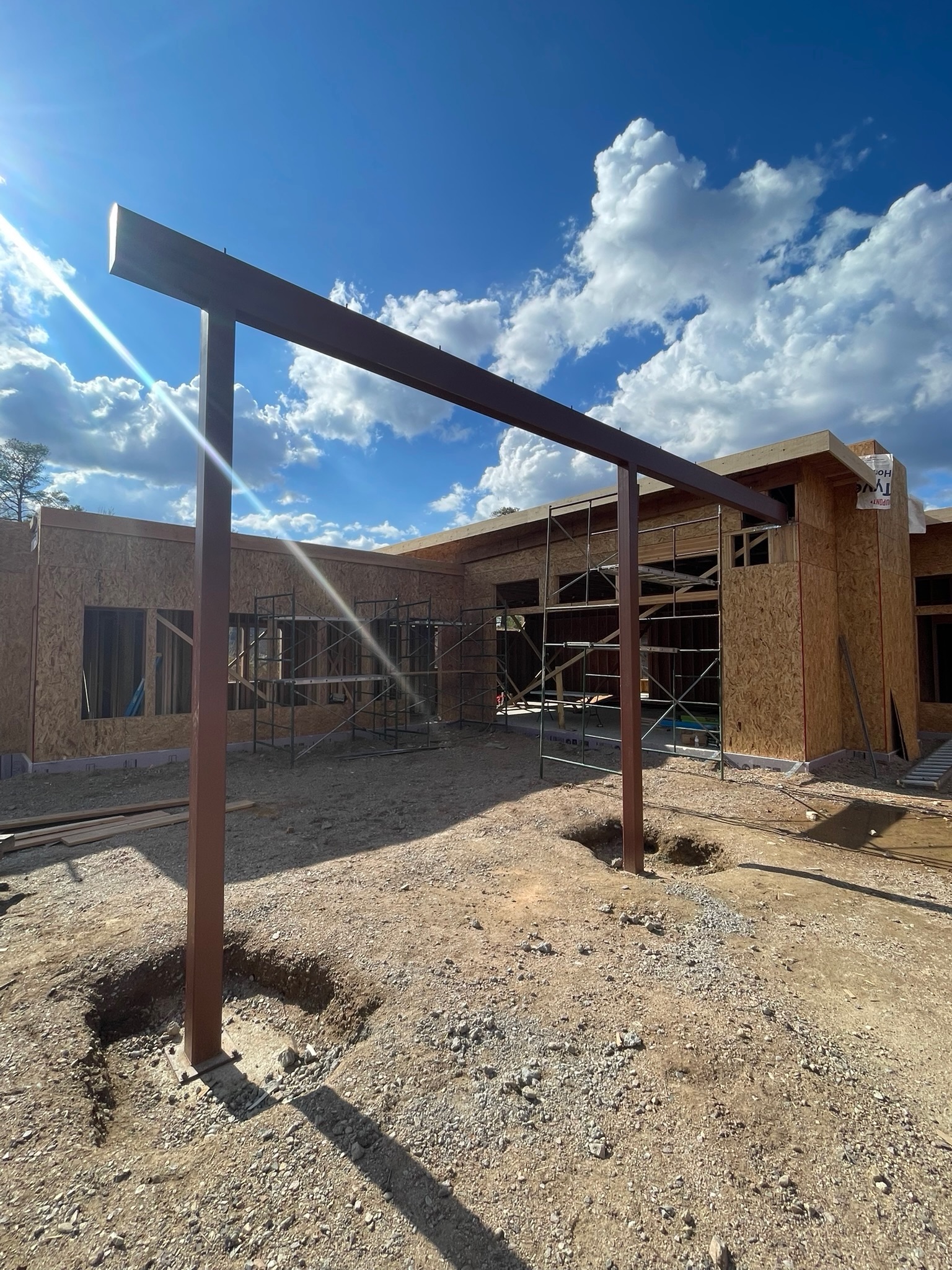 Welded steel moment frame erected on a custom home build